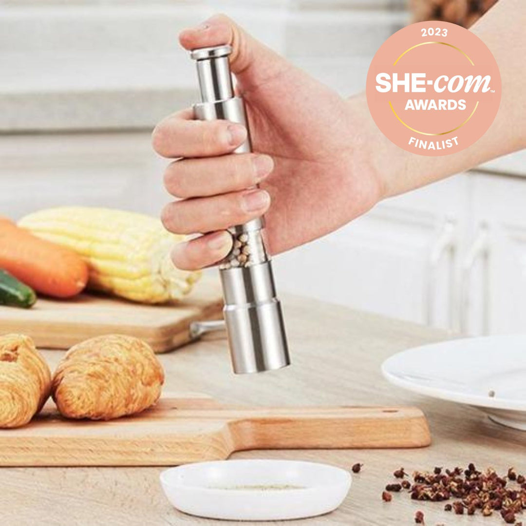 Tweed Real Food small stainless steel spice grinder with manual thumb push