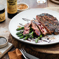 Steak on asparagus with balsamic drizzle made with the BBQ Deluxe Gift Hamper